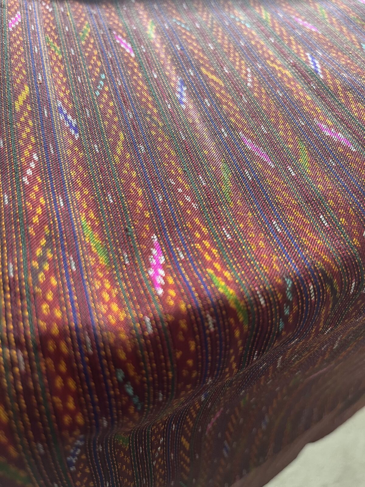 Hol silk in deep mulberry with fine bands of marigold, pink, and jade